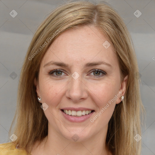 Joyful white adult female with medium  brown hair and brown eyes