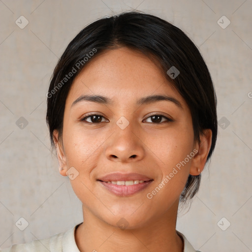 Joyful latino young-adult female with medium  brown hair and brown eyes