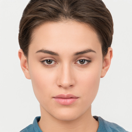 Neutral white young-adult female with short  brown hair and brown eyes