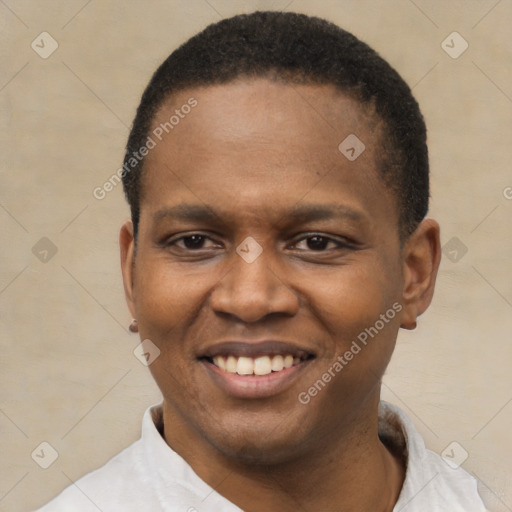 Joyful black young-adult male with short  black hair and brown eyes