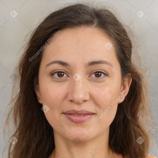 Joyful white adult female with long  brown hair and brown eyes