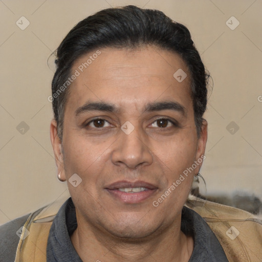 Joyful white adult male with short  black hair and brown eyes
