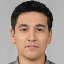 Neutral white young-adult male with short  black hair and brown eyes