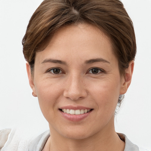 Joyful white young-adult female with short  brown hair and brown eyes