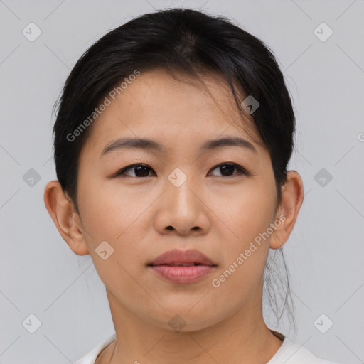 Joyful asian young-adult female with short  brown hair and brown eyes