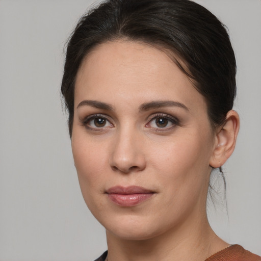 Joyful white young-adult female with medium  brown hair and brown eyes