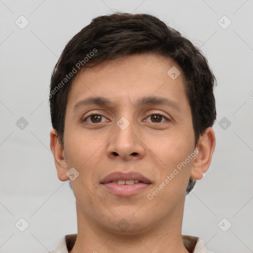 Joyful white young-adult male with short  brown hair and brown eyes