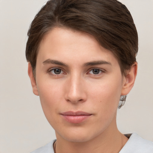 Neutral white young-adult female with short  brown hair and brown eyes