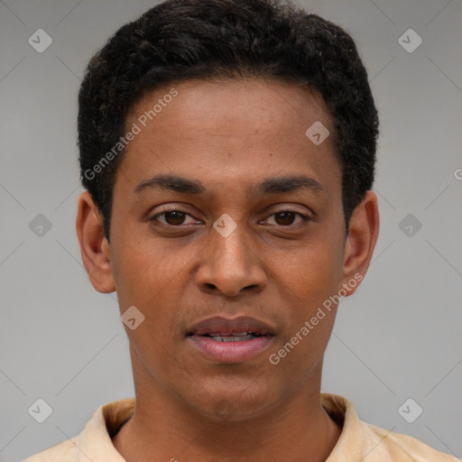 Joyful latino young-adult male with short  brown hair and brown eyes