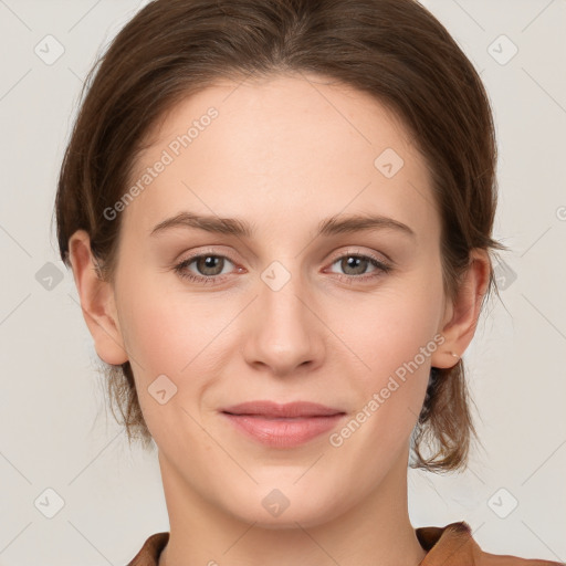 Joyful white young-adult female with medium  brown hair and grey eyes