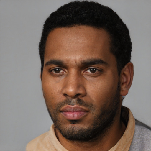 Neutral black young-adult male with short  black hair and brown eyes