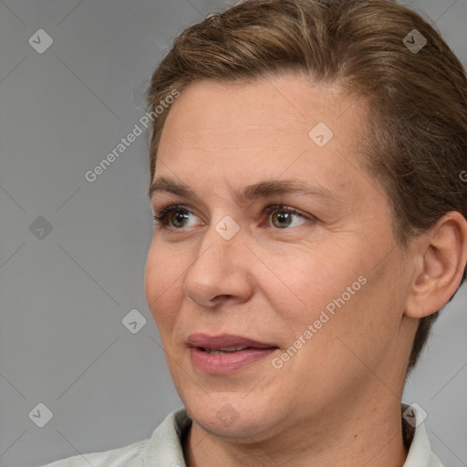 Joyful white adult female with short  brown hair and brown eyes