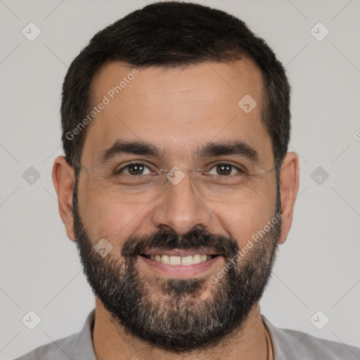 Joyful white adult male with short  black hair and brown eyes