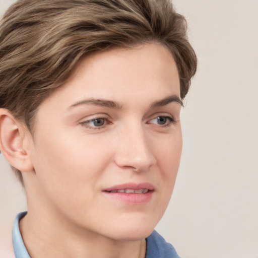 Joyful white young-adult female with medium  brown hair and blue eyes