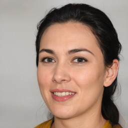 Joyful white young-adult female with medium  brown hair and brown eyes