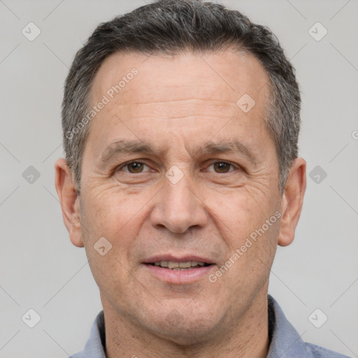 Joyful white middle-aged male with short  brown hair and brown eyes