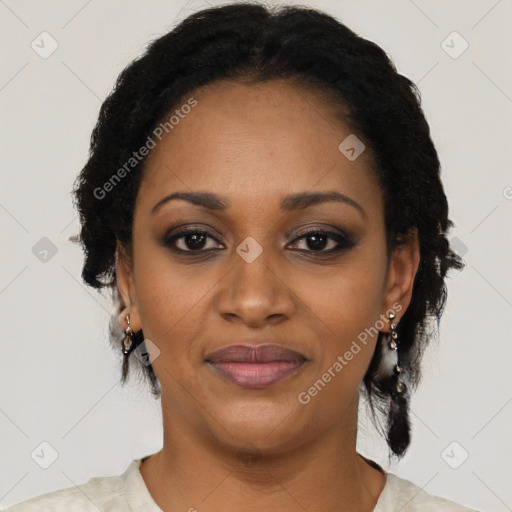 Joyful black adult female with short  black hair and brown eyes