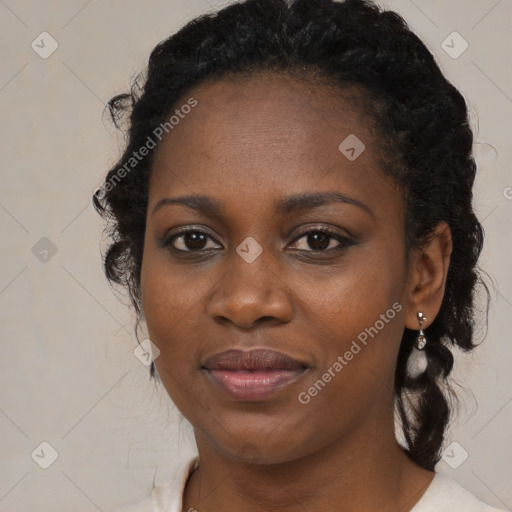 Joyful black young-adult female with medium  black hair and brown eyes