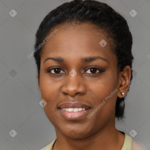 Joyful black young-adult female with short  brown hair and brown eyes