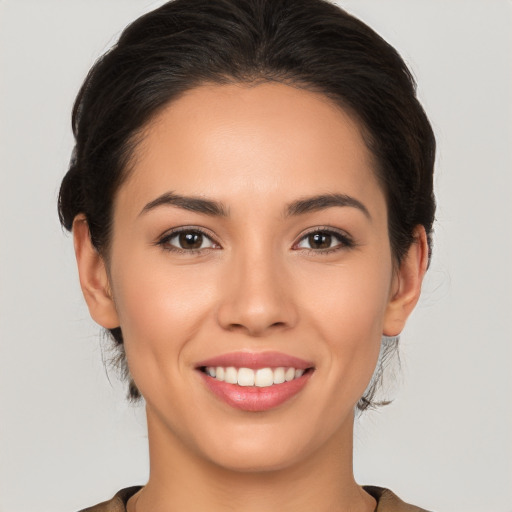 Joyful white young-adult female with long  brown hair and brown eyes