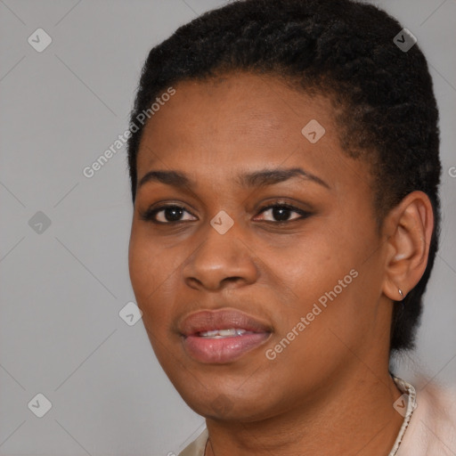 Joyful black young-adult female with short  black hair and brown eyes