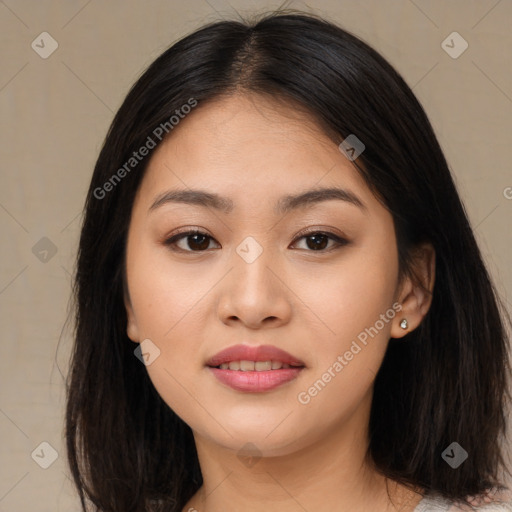 Joyful asian young-adult female with long  brown hair and brown eyes