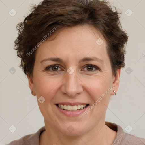 Joyful white adult female with short  brown hair and brown eyes