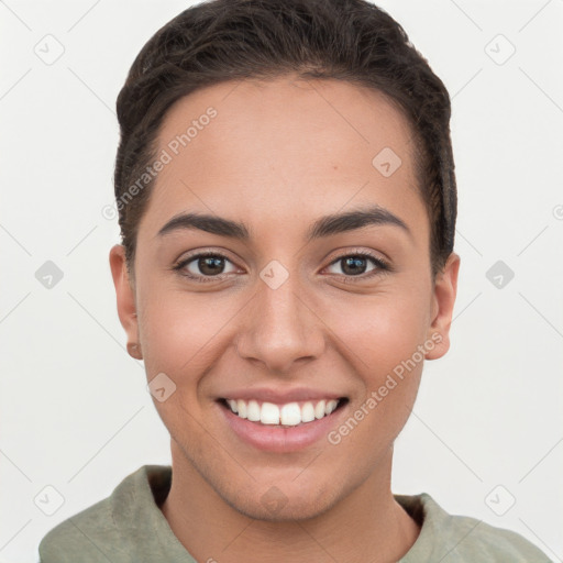 Joyful white young-adult female with short  brown hair and brown eyes