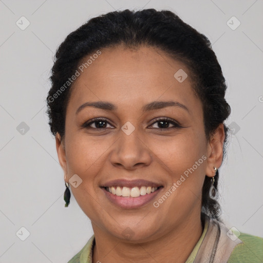 Joyful black adult female with short  brown hair and brown eyes