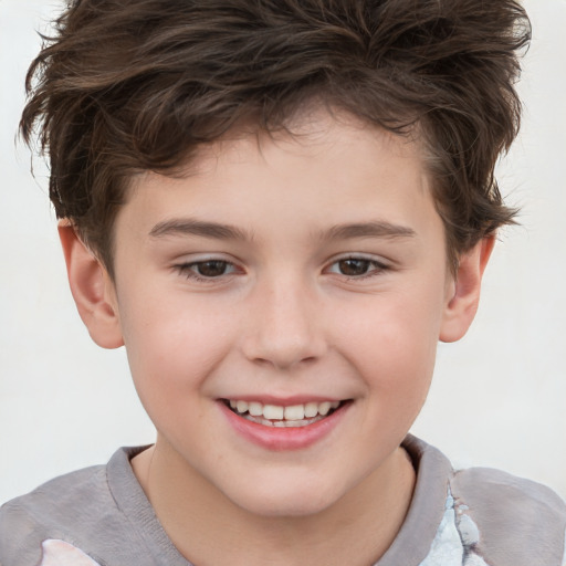 Joyful white child male with short  brown hair and brown eyes