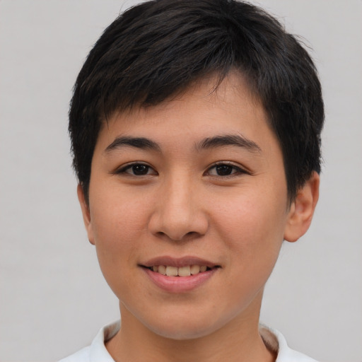 Joyful asian young-adult female with short  brown hair and brown eyes