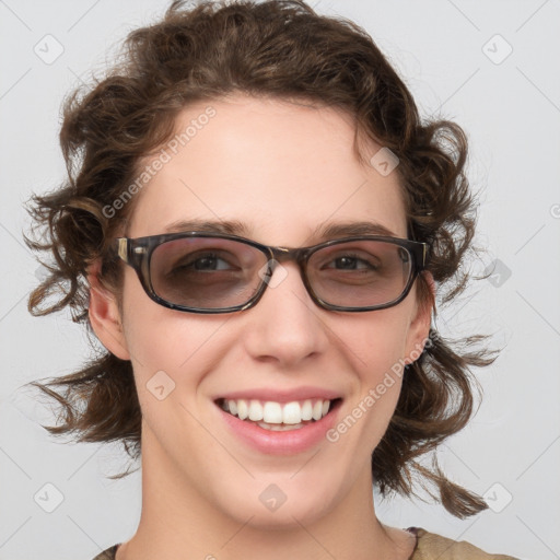 Joyful white young-adult female with medium  brown hair and blue eyes