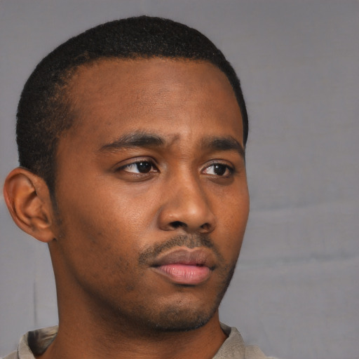 Neutral black young-adult male with short  brown hair and brown eyes