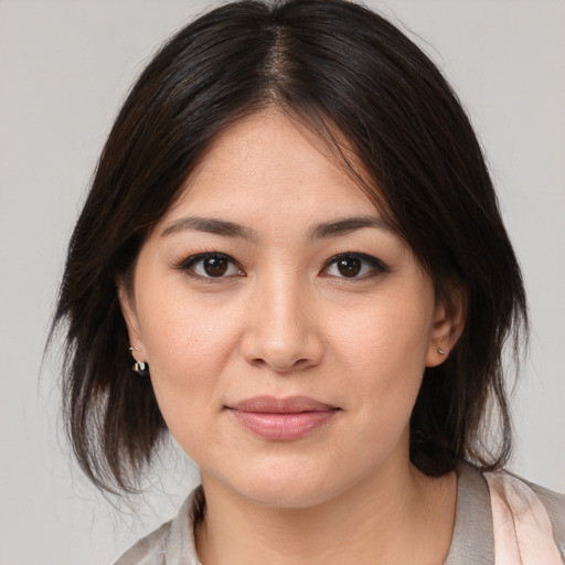 Joyful white young-adult female with medium  brown hair and brown eyes