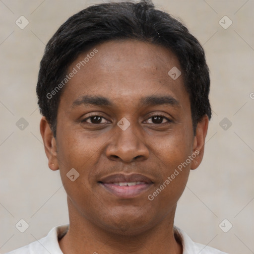 Joyful black young-adult male with short  black hair and brown eyes