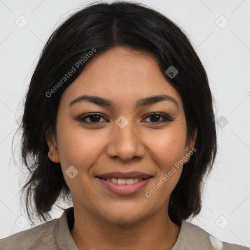 Joyful latino young-adult female with medium  brown hair and brown eyes