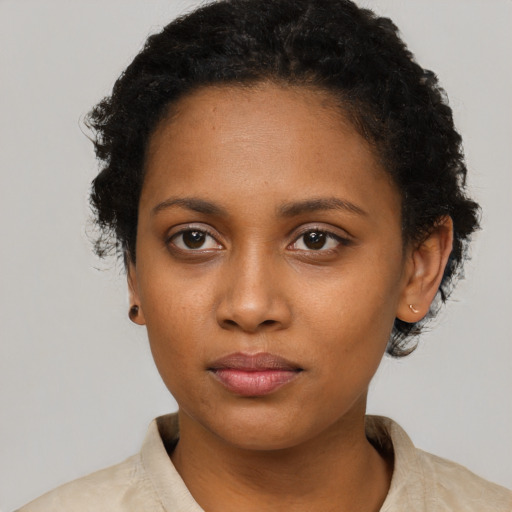 Neutral black young-adult female with short  black hair and brown eyes