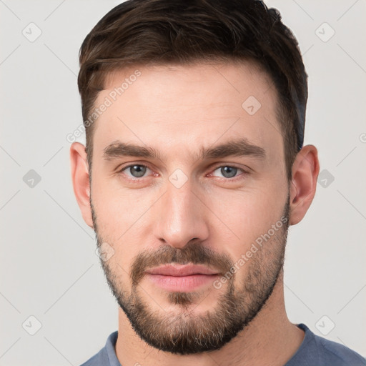 Neutral white young-adult male with short  brown hair and grey eyes