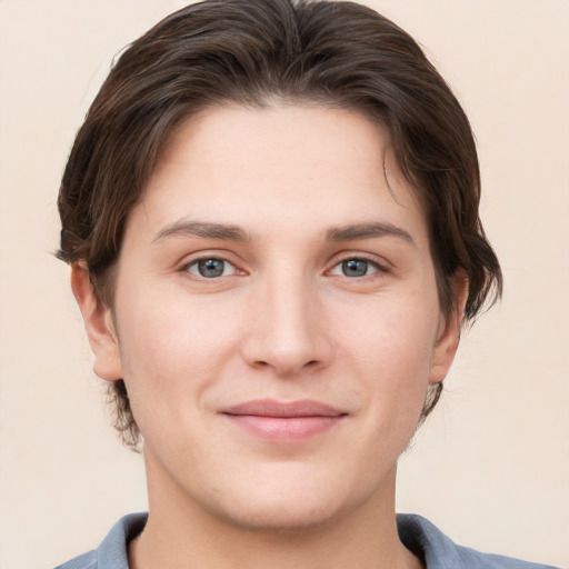 Joyful white young-adult female with short  brown hair and grey eyes