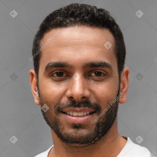 Joyful black young-adult male with short  black hair and brown eyes