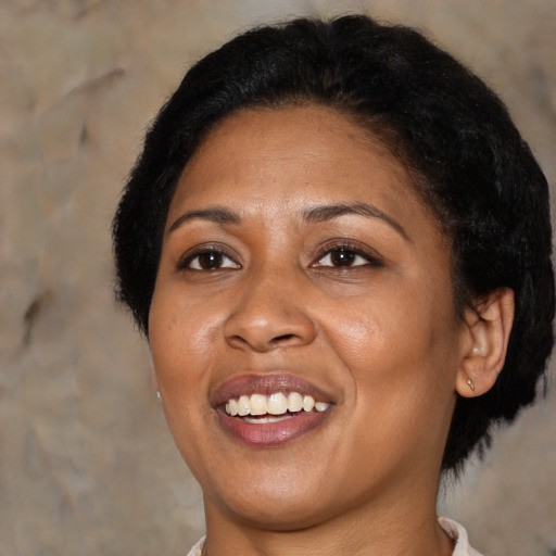 Joyful asian adult female with medium  brown hair and brown eyes
