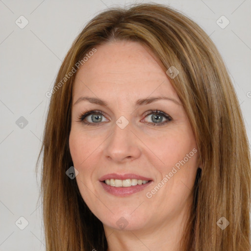 Joyful white adult female with long  brown hair and brown eyes