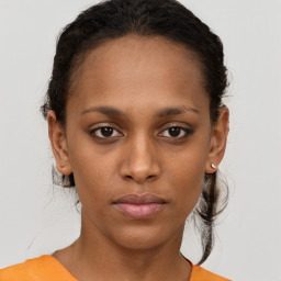 Neutral black young-adult female with short  brown hair and brown eyes