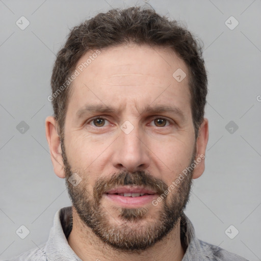 Neutral white adult male with short  brown hair and brown eyes