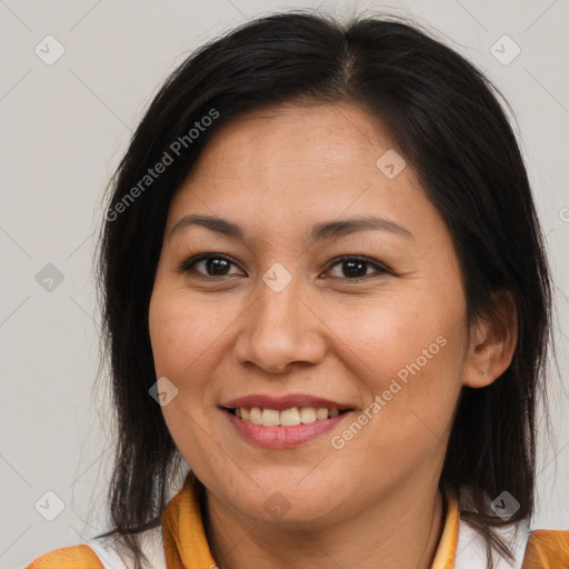 Joyful asian adult female with medium  brown hair and brown eyes