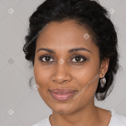 Joyful black young-adult female with medium  brown hair and brown eyes