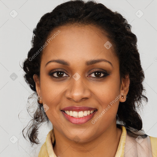 Joyful black young-adult female with long  black hair and brown eyes