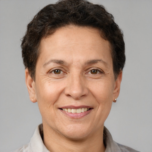 Joyful white adult female with short  brown hair and brown eyes