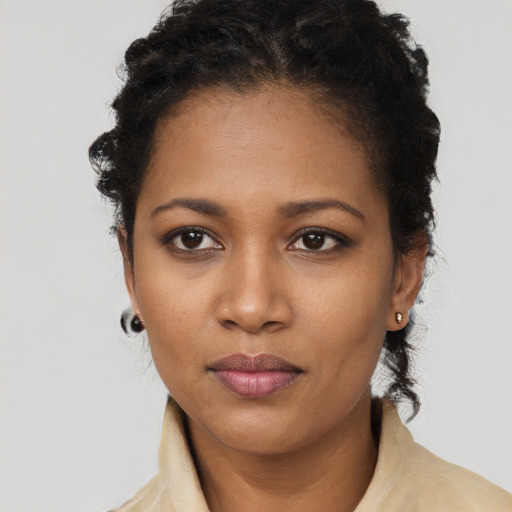 Neutral black young-adult female with short  black hair and brown eyes