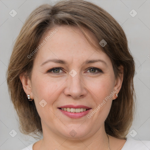 Joyful white adult female with medium  brown hair and grey eyes